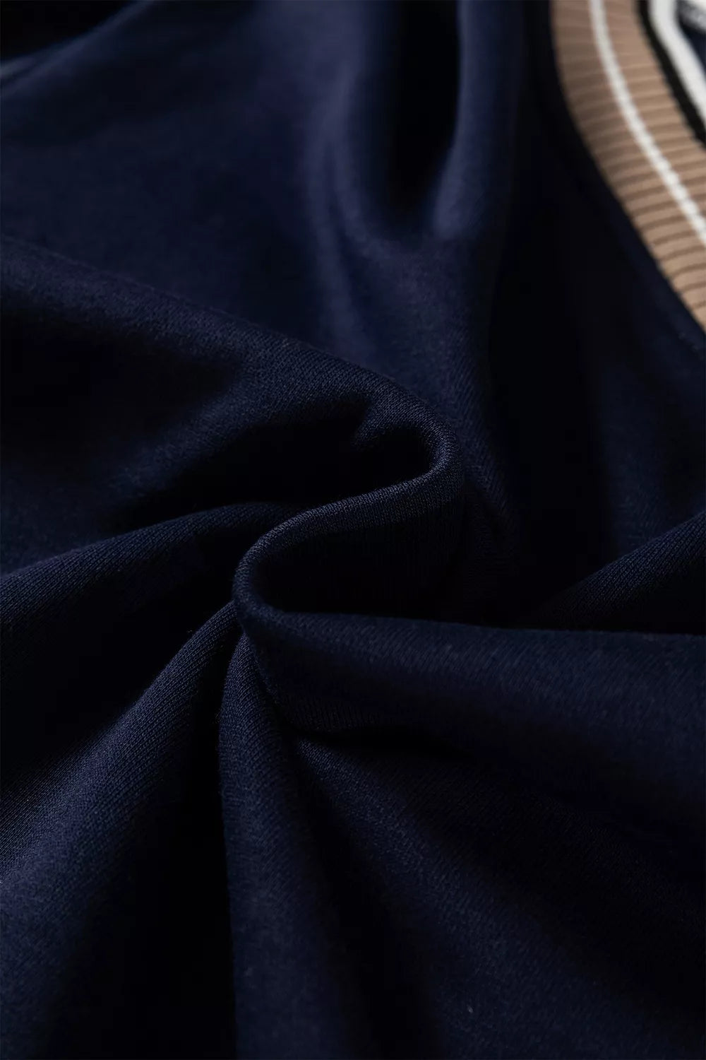 Contrast striped trim V-neck sweatshirt from Trendsi featuring a casual fit and stylish color-block design.
