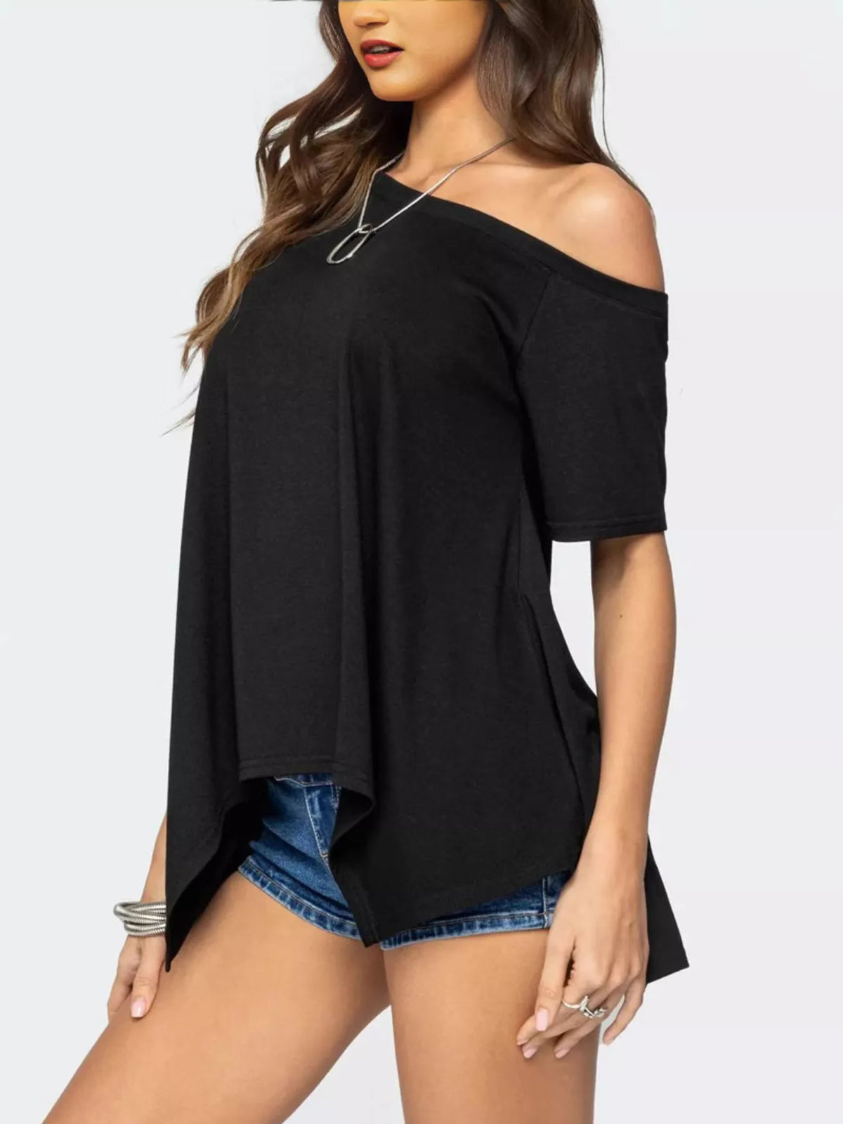 Women's off-shoulder asymmetrical flowy T-shirt from Plush Fashion Hub, featuring a stylish and relaxed fit with a unique hemline.