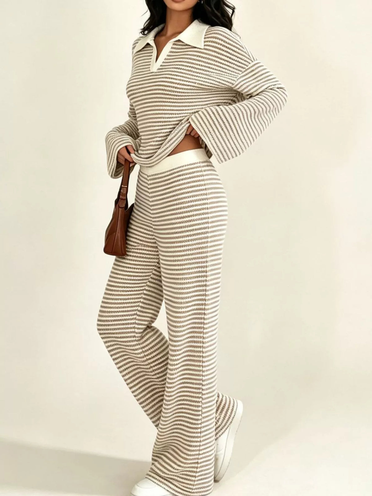 Striped long sleeve polo and wide-leg pants set by Trendsi, featuring a stylish coordinated outfit with bold stripes and comfortable fit.