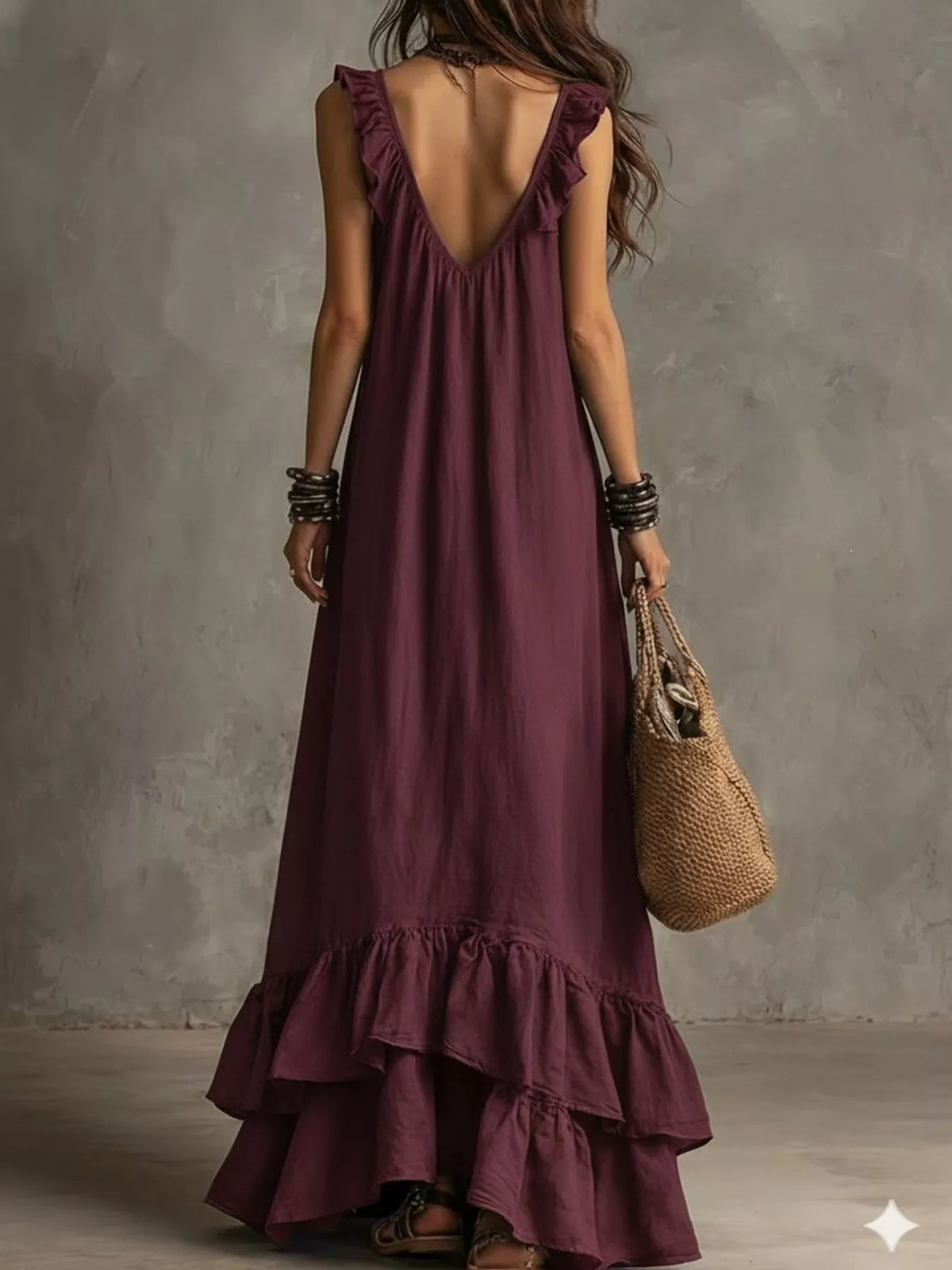 Ruffled sleeveless maxi dress by Plush Fashion Hub with flowing fabric and elegant ruffle details, perfect for summer wear.