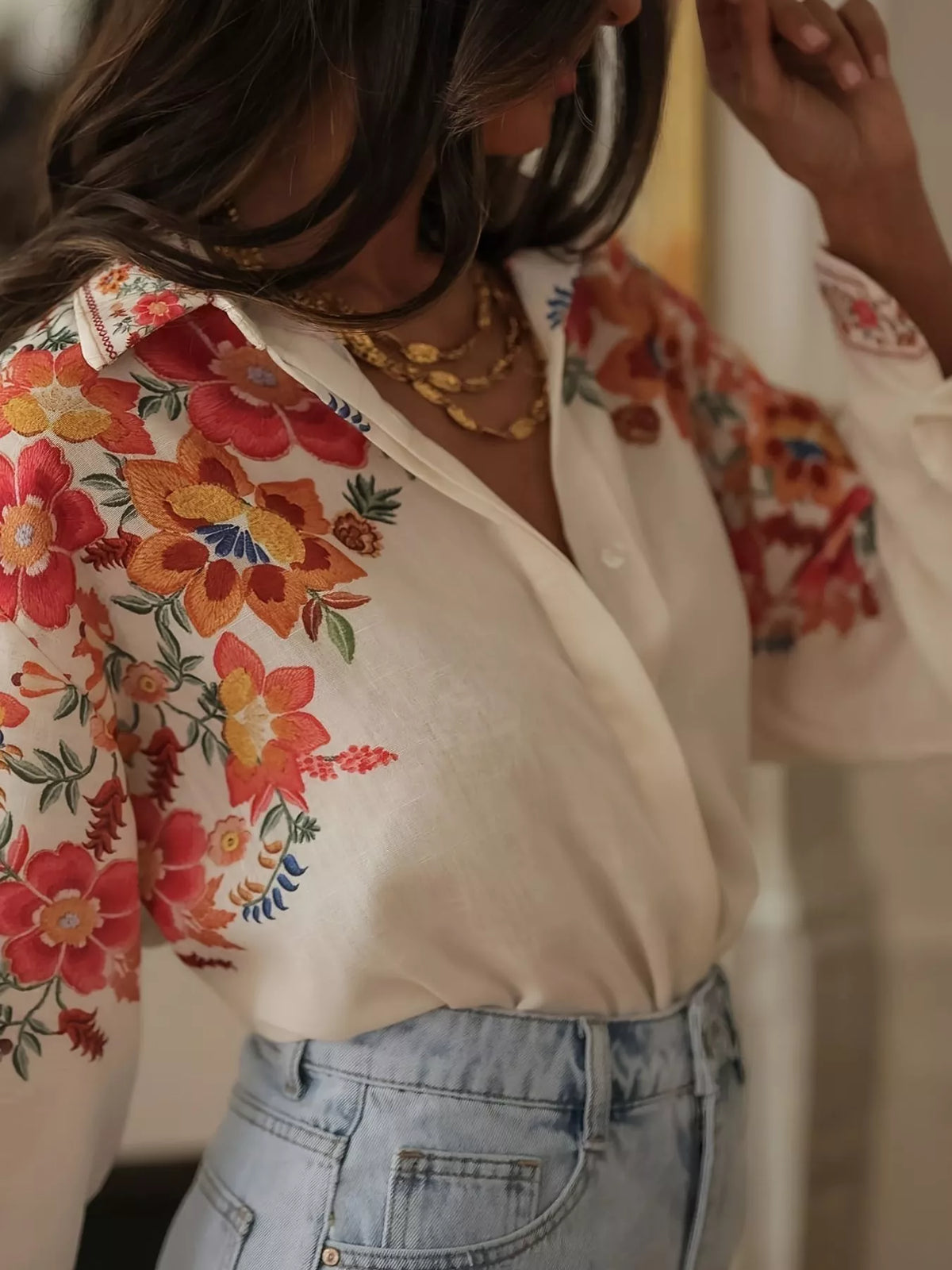 Floral print button-up shirt by Plush Fashion Hub featuring a colorful floral design and classic collar style.