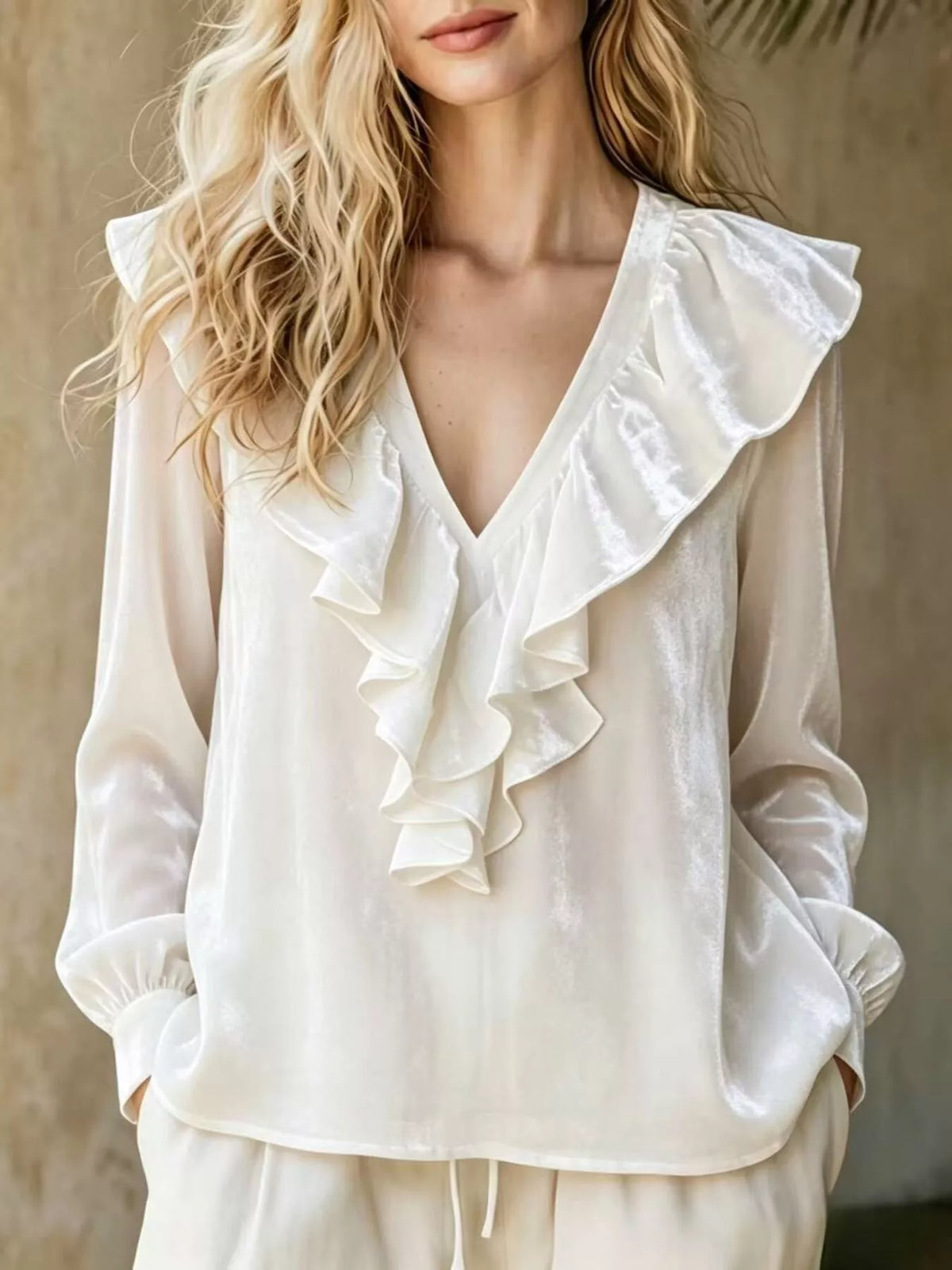 Plus size long sleeve V-neck ruffled blouse by Trendsi, featuring a stylish design and full-size fit, shown with ruffle details.