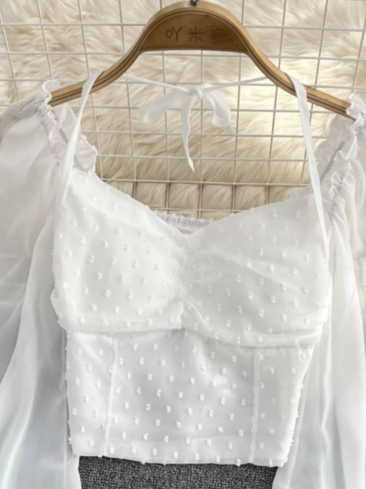 Elegant long sleeve Swiss dot ruffled flounce sleeve blouse by Plush Fashion Hub, featuring a charming dress style with intricate detailing.