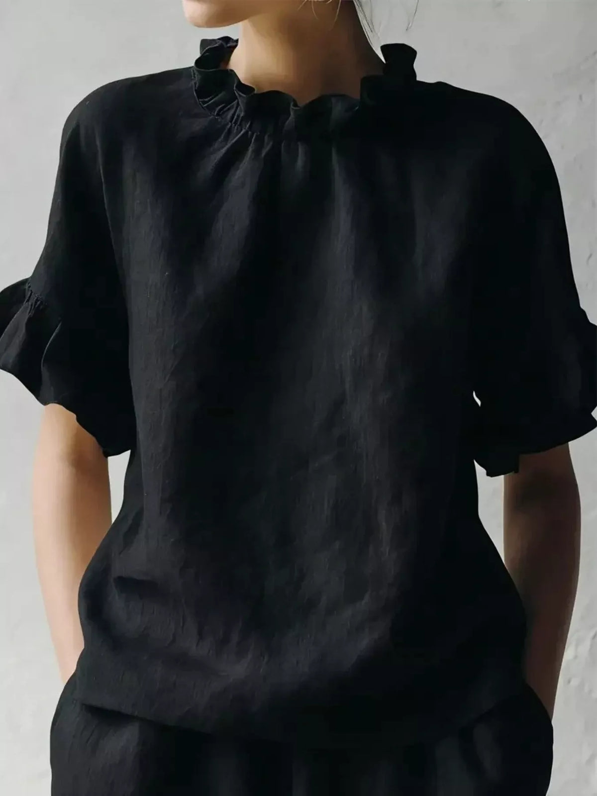 Plus size ruffled neck half sleeve blouse by Plush Fashion Hub featuring a stylish full-size design and elegant ruffle detail.