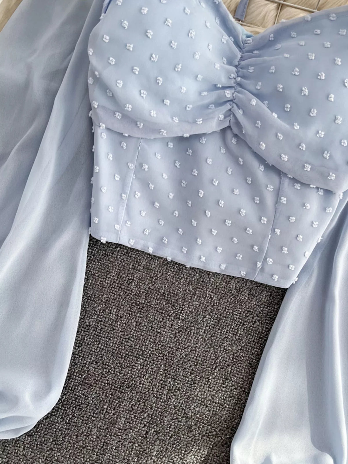 Elegant long sleeve Swiss Dot ruffled flounce sleeve blouse by Plush Fashion Hub, showcasing delicate fabric and feminine design.