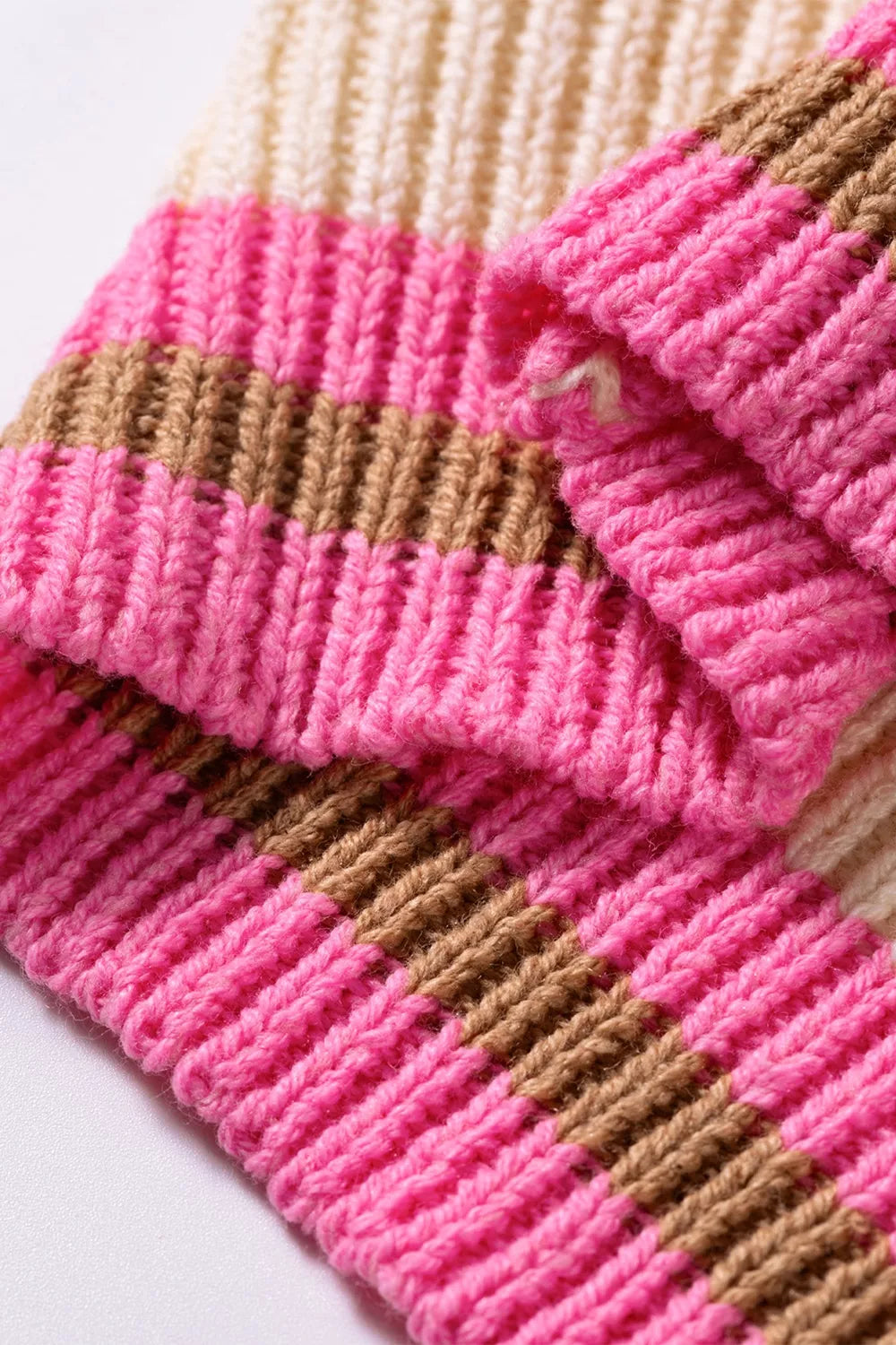 Women's striped colorblock textured drop shoulder sweater by Trendsi, featuring bold stripes and cozy knit fabric.