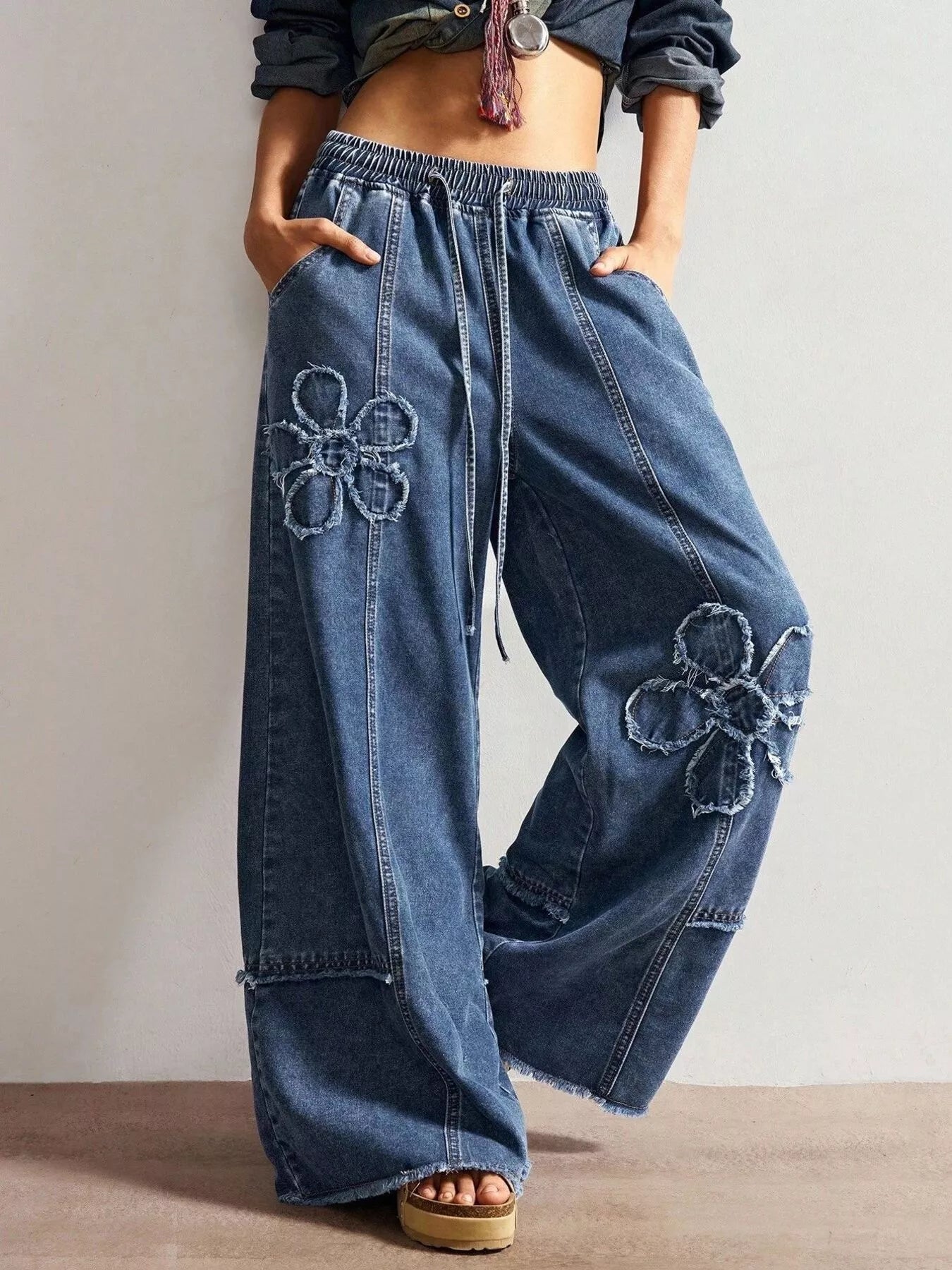 Shopimist floral appliques wide leg jeans with embroidered floral patches and relaxed fit, showcasing stylish denim design.
