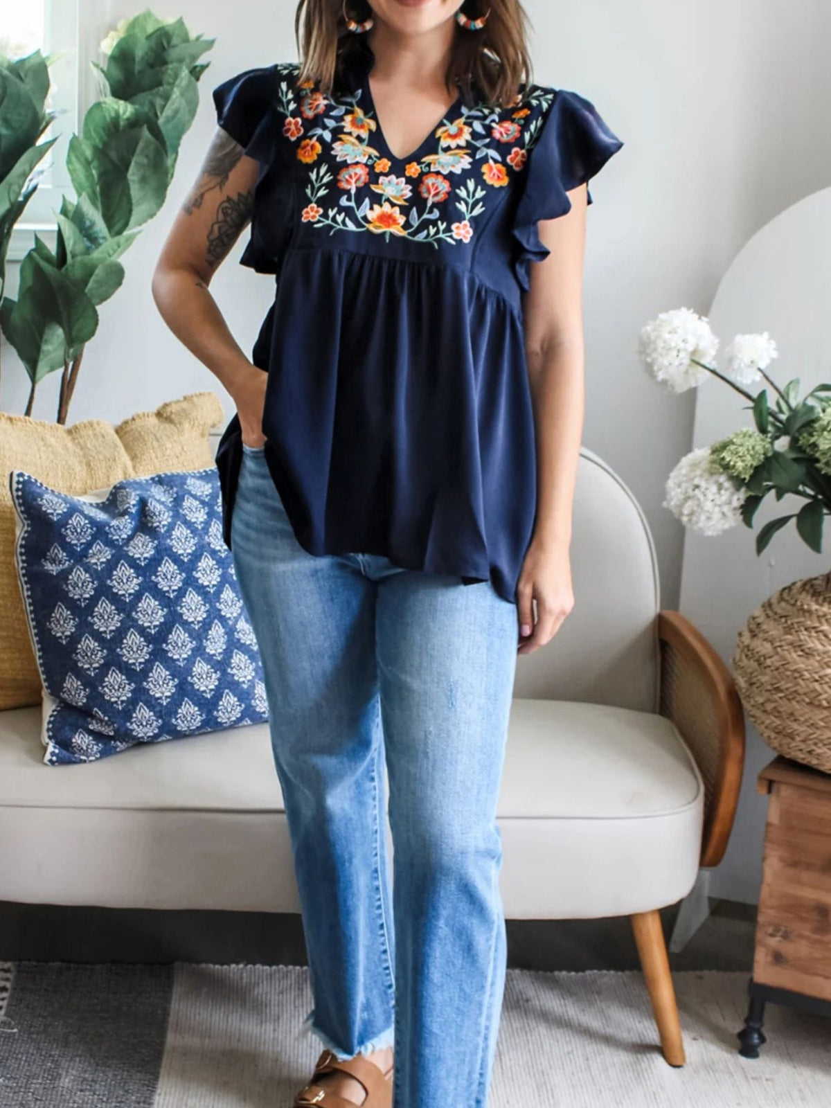 Women’s embroidered floral ruffle sleeve blouse by Plush Fashion Hub, lightweight and elegant, featuring intricate floral embroidery.