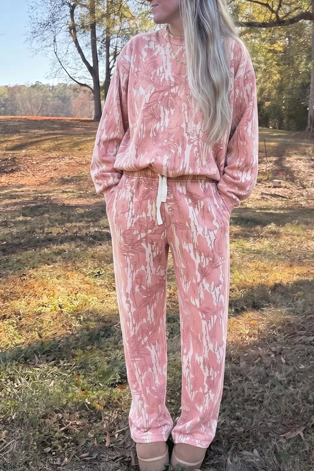 Multicolour abstract botanical print top and drawstring pants set by Trendsi, featuring vibrant design and comfortable fit.