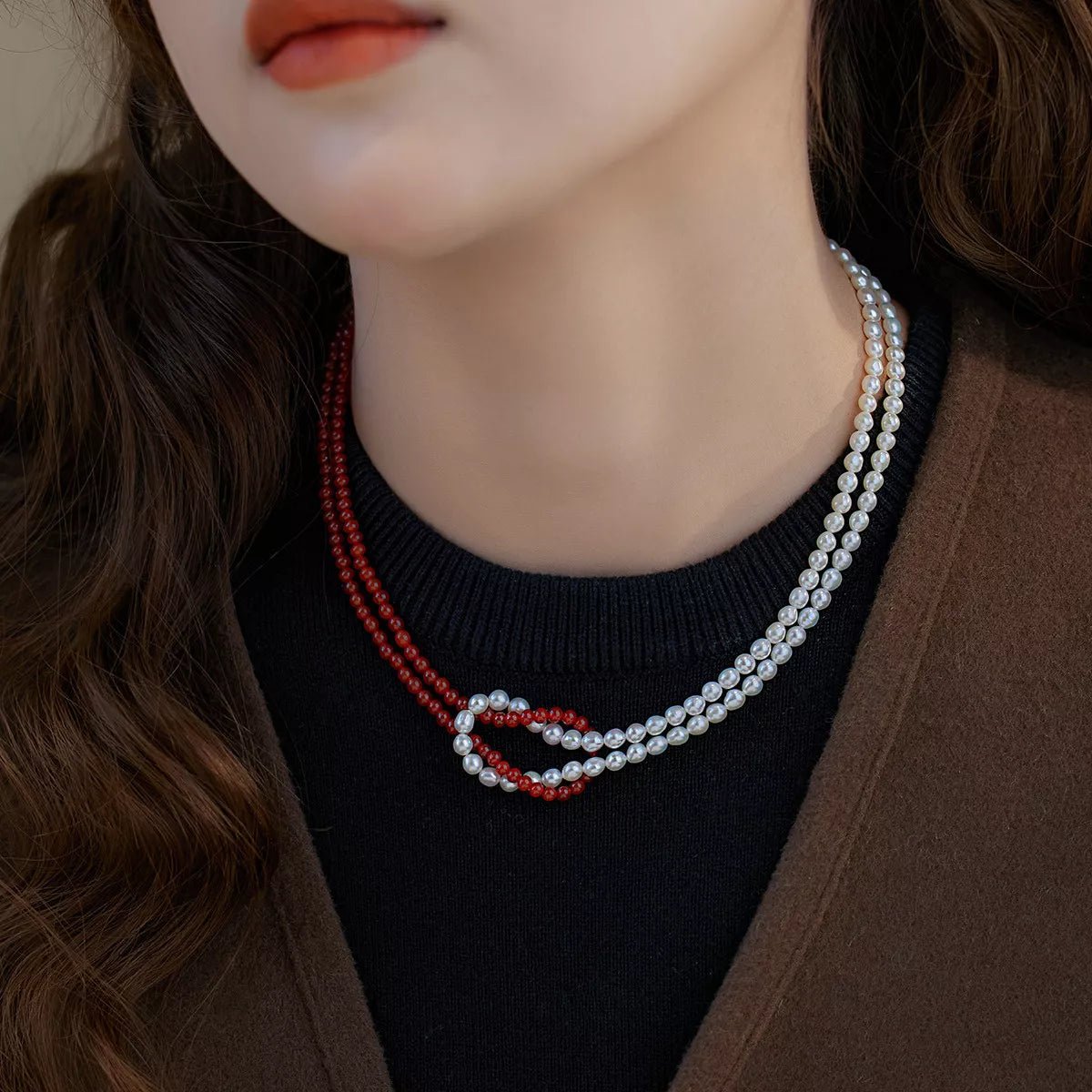 Double layered knot necklace from Plush Fashion Hub showcasing intertwined silver-tone chains on a neutral background.
