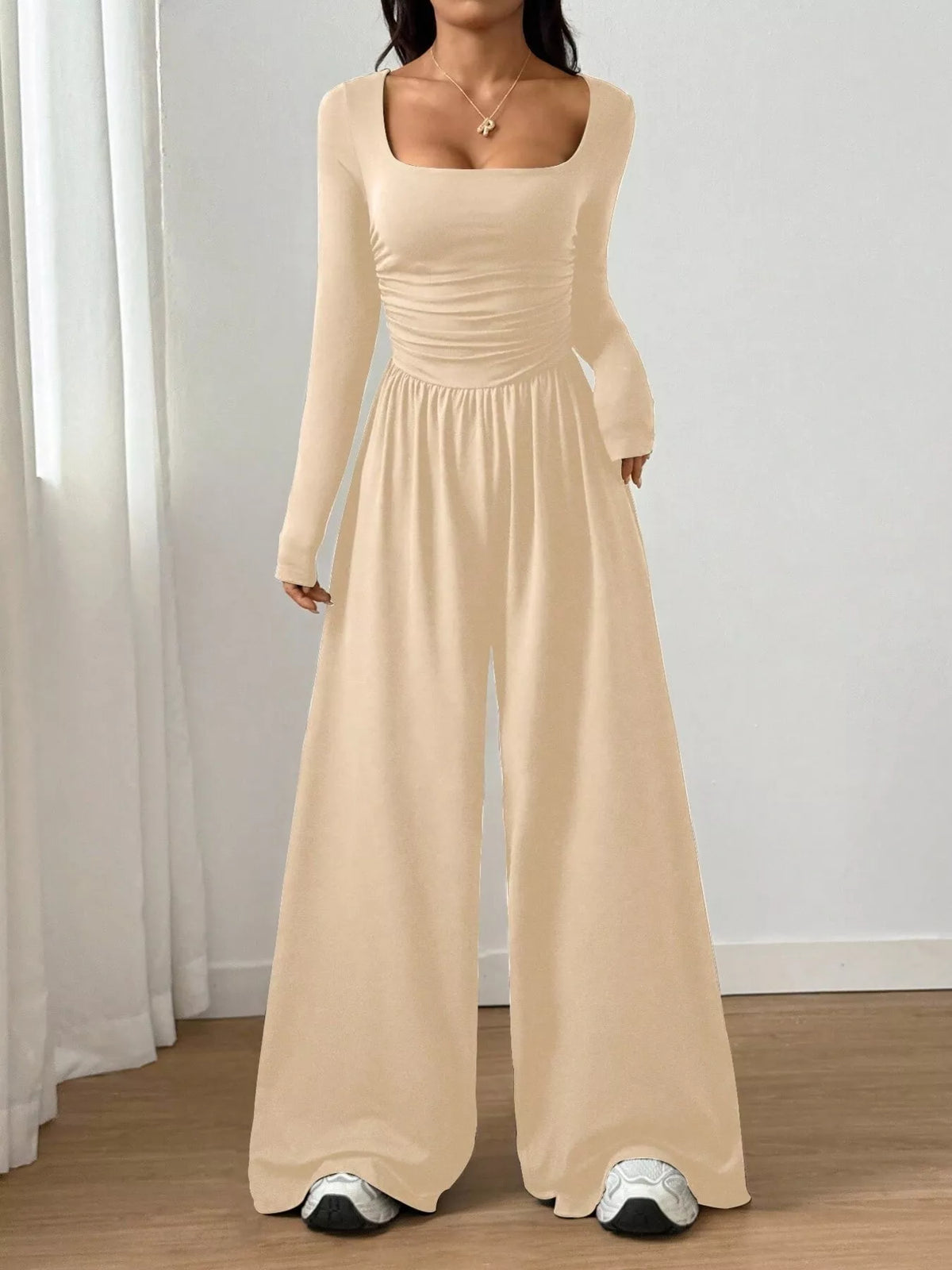 Ruched square neck wide-leg jumpsuit from Trendsi, featuring a stylish design and comfortable fit, shown on a model.