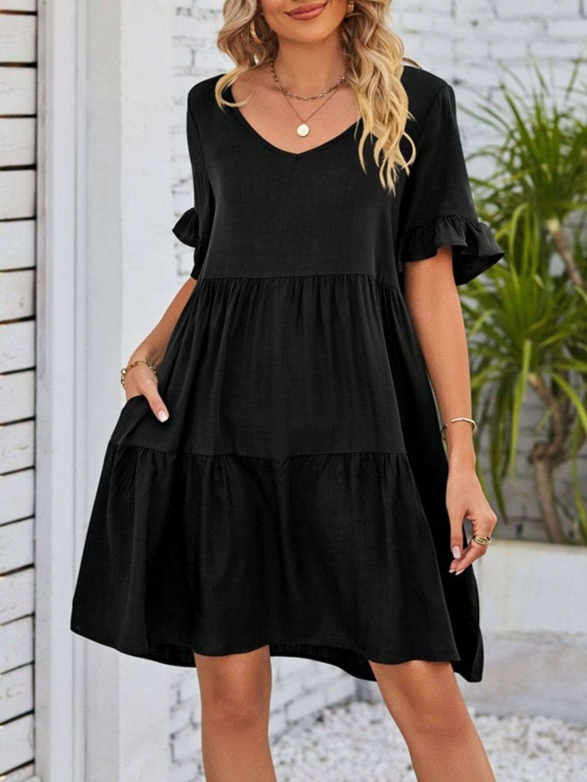 Lightweight rayon mini dress with ruffled sleeves, tiered design, and pockets from Plush Fashion Hub.