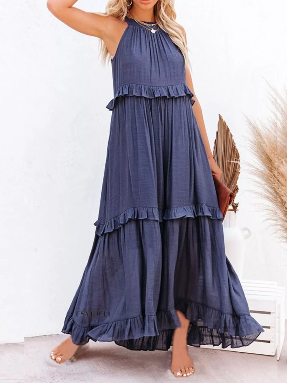 Plush Fashion Hub ruffled tiered sleeveless maxi dress with flowing fabric and layered design, perfect for summer or special occasions.