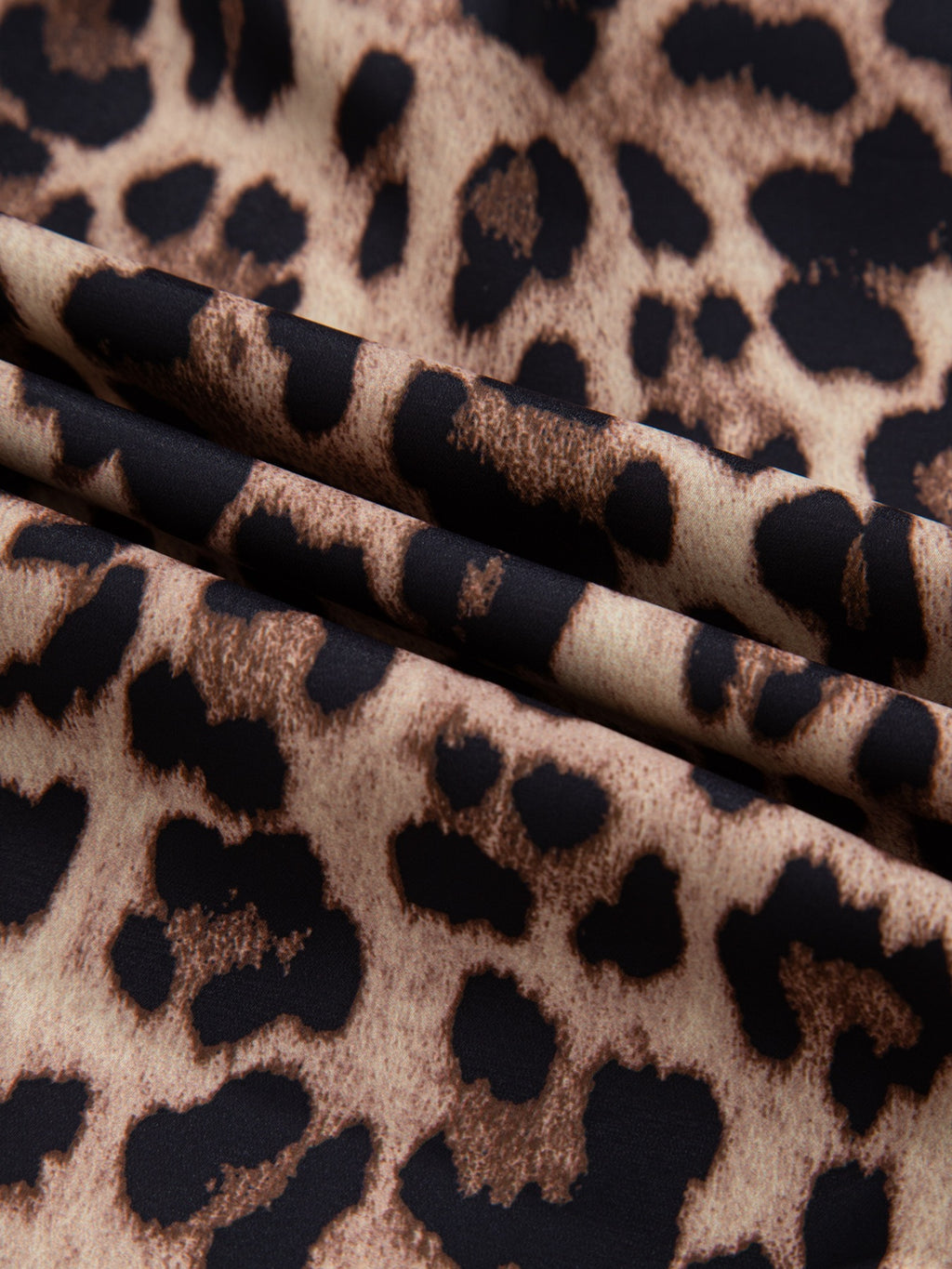 Leopard print short sleeve blouse with lace trim and button front, stylish trendy top by Trendsi, perfect for casual wear.