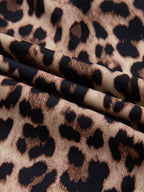 Leopard print short sleeve blouse with lace trim and button front, stylish trendy top by Trendsi, perfect for casual wear.