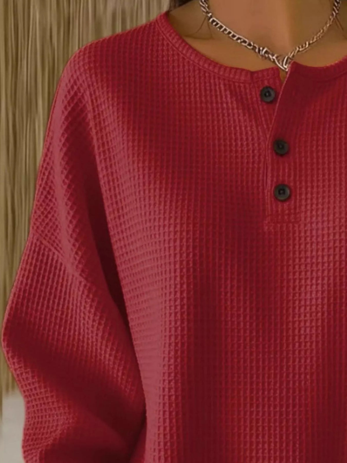 Plus size waffle knit top with button details from Trendsi, featuring a cozy, textured fabric and relaxed fit.