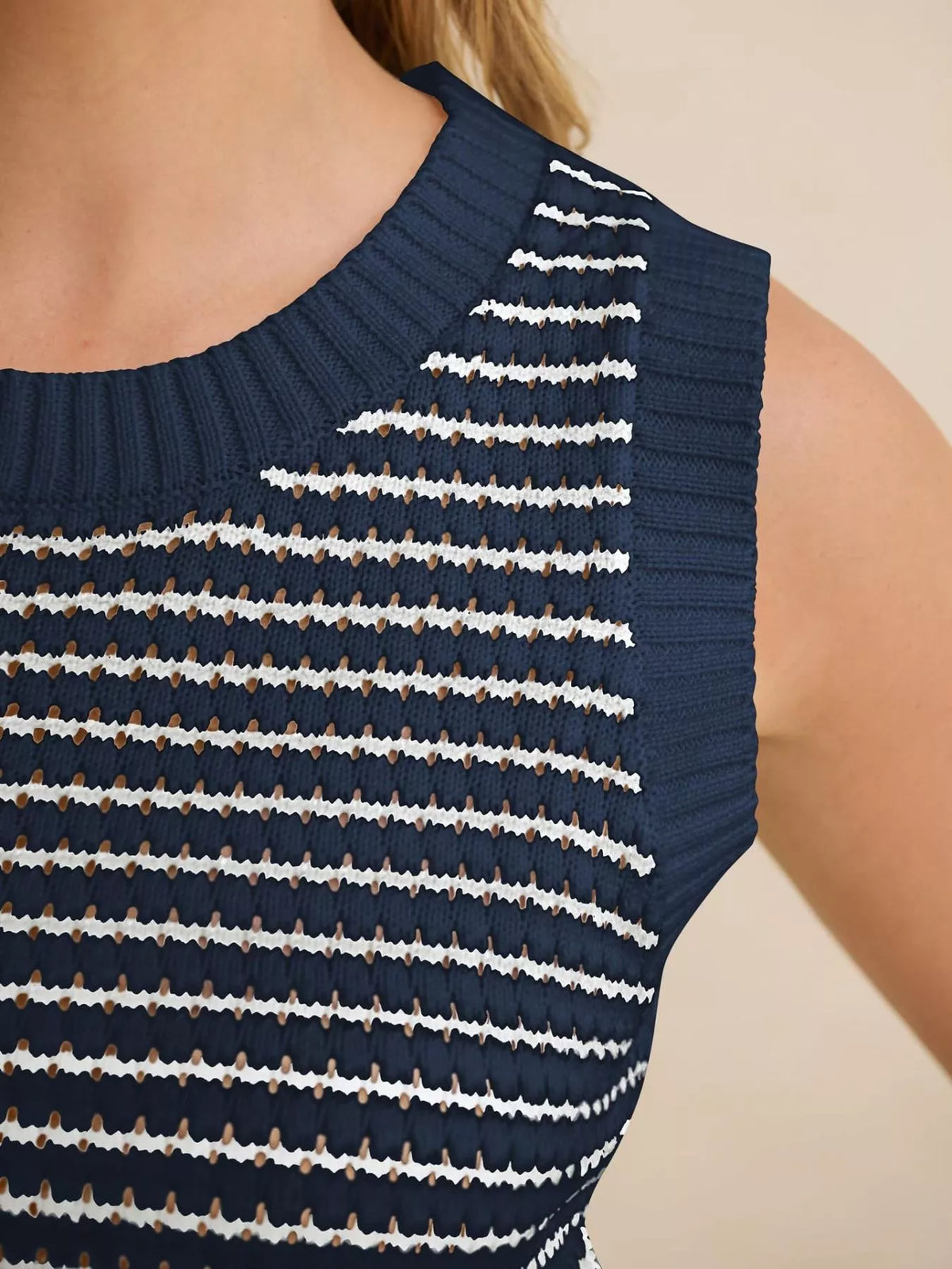 Striped knit sweater vest by Plush Fashion Hub, featuring a stylish design and comfortable fit, displayed on a neutral background.