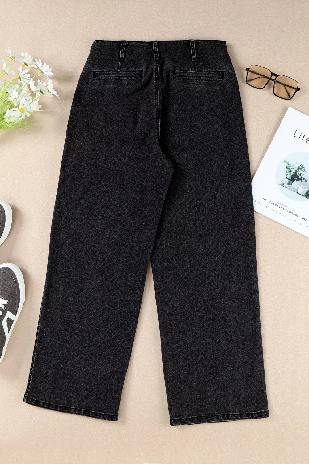 Plush Fashion Hub high-waisted wide-leg jeans with button-fly, showcasing denim fabric and relaxed fit style.