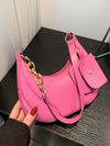 Pink PU leather shoulder bag with gold chain accents and attached EarPods bag.