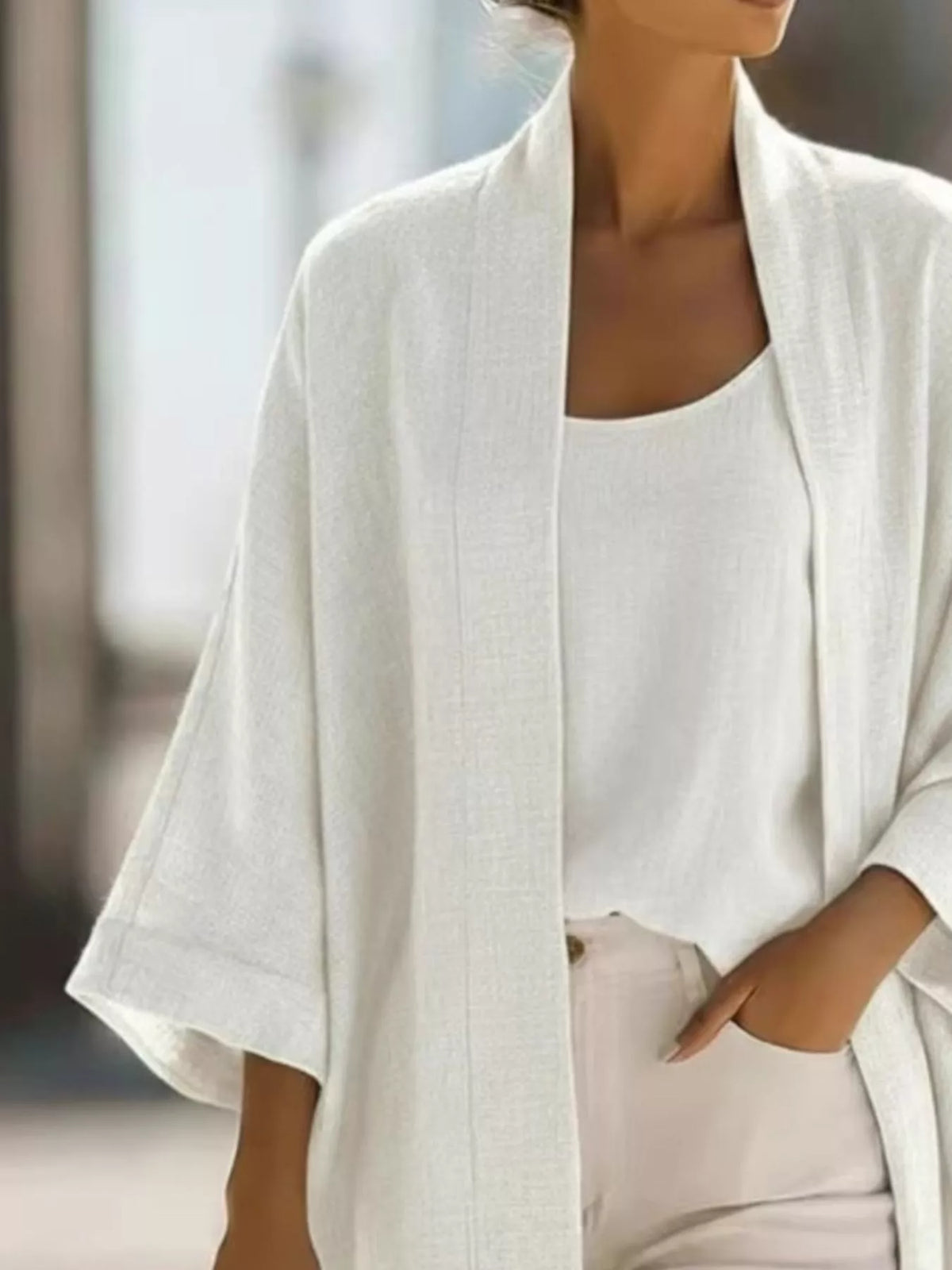Plus size open-front cardigan and matching tank top set by Trendsi, featuring a cozy, stylish knit fabric in natural colors.