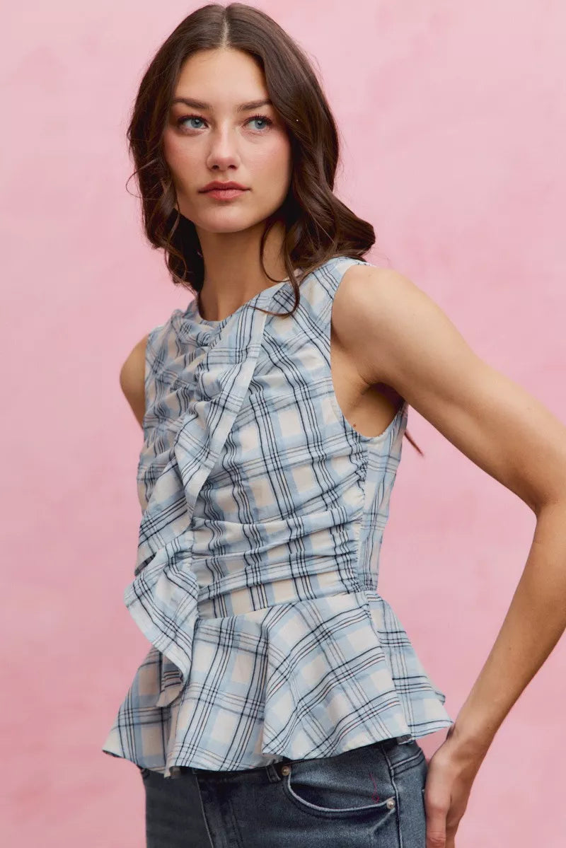 Plaid sleeveless ruffle peplum top from Plush Fashion Hub featuring a fitted waist and stylish ruffle details.