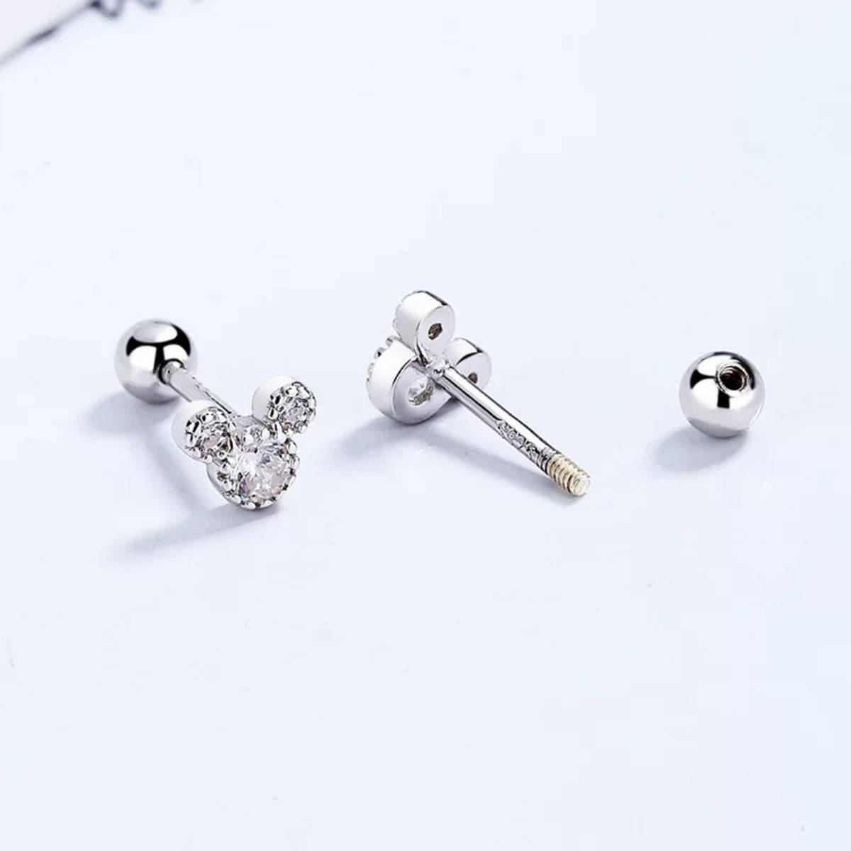 Plush Fashion Hub Mickey Mouse stud earrings featuring small, detailed Mickey Mouse face charms on silver posts.