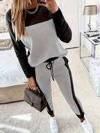 Women's Korean-style hoodie and pants two-piece set by Plush Fashion Hub, featuring casual patchwork design and comfortable fit.