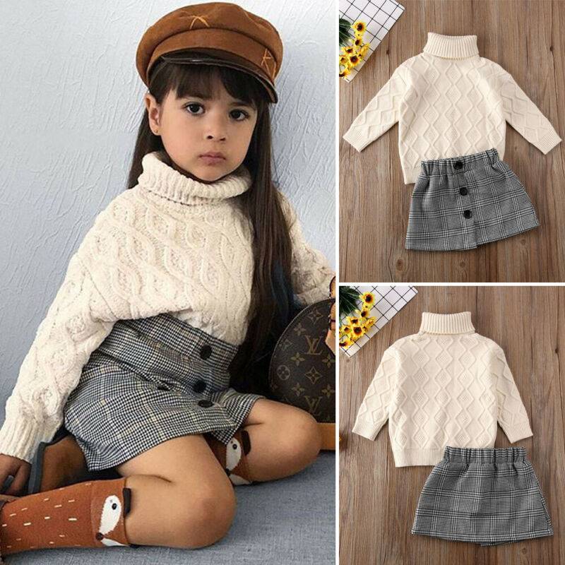 Turtleneck sweater + plaid skirt suitThis elegant suit features a turtleneck sweater and plaid skirt, perfect for any occasion. Long sleeves provide warmth, while the cotton fabric guarantees comfort. WGirls 2 piece setPlush Fashions ShopPlush Fashion Shop