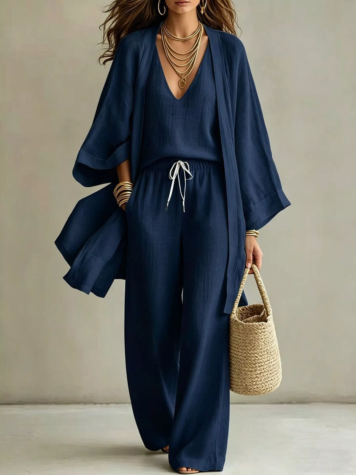 Plus size V-neck tank cardigan and pants loungewear set by Trendsi, soft fabric with relaxed fit in a comfortable, stylish design.