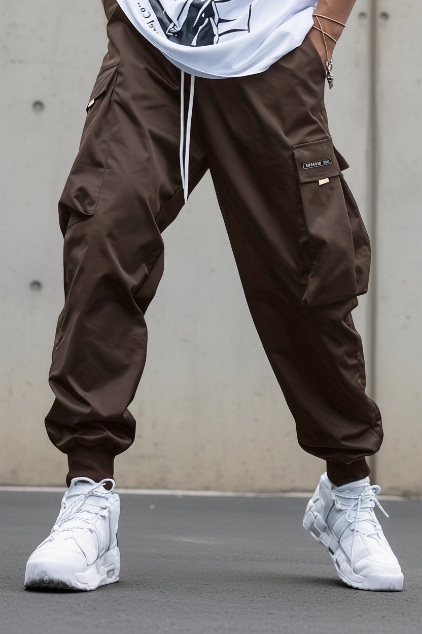 Men’s multi-pocket drawstring cargo pants by FitiqueFit, streetwear style, shown with multiple side and back pockets.