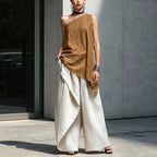 Women's one-shoulder asymmetric sleeveless top by Plush Fashion Hub, shown in a stylish, modern design.