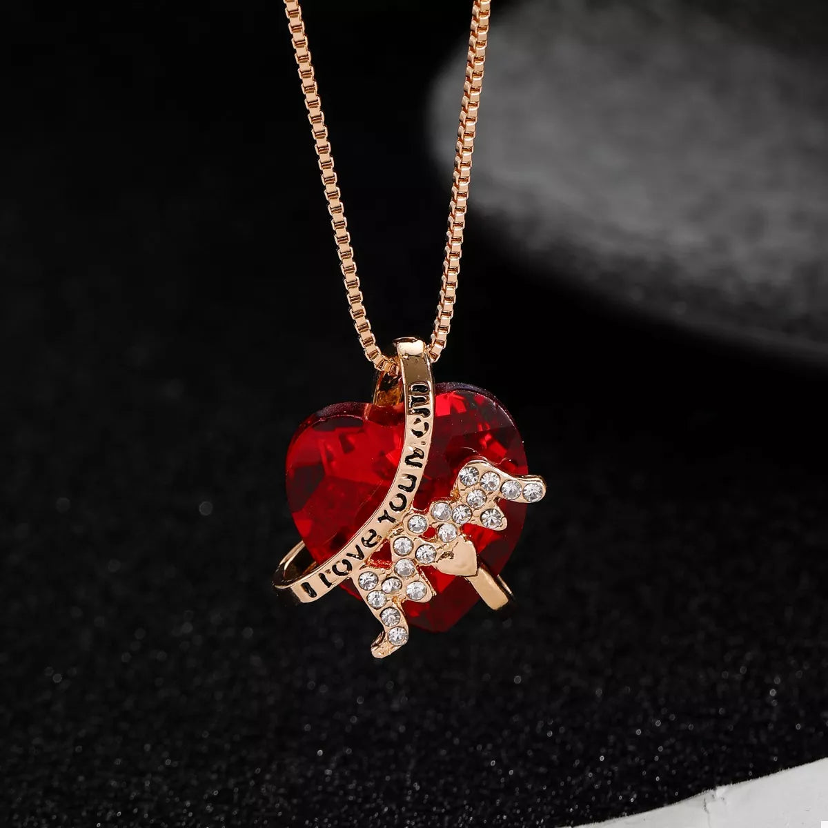 Heart-shaped MOM pendant necklace in gold with a delicate chain, featuring a heartfelt design from Plush Fashion Hub.