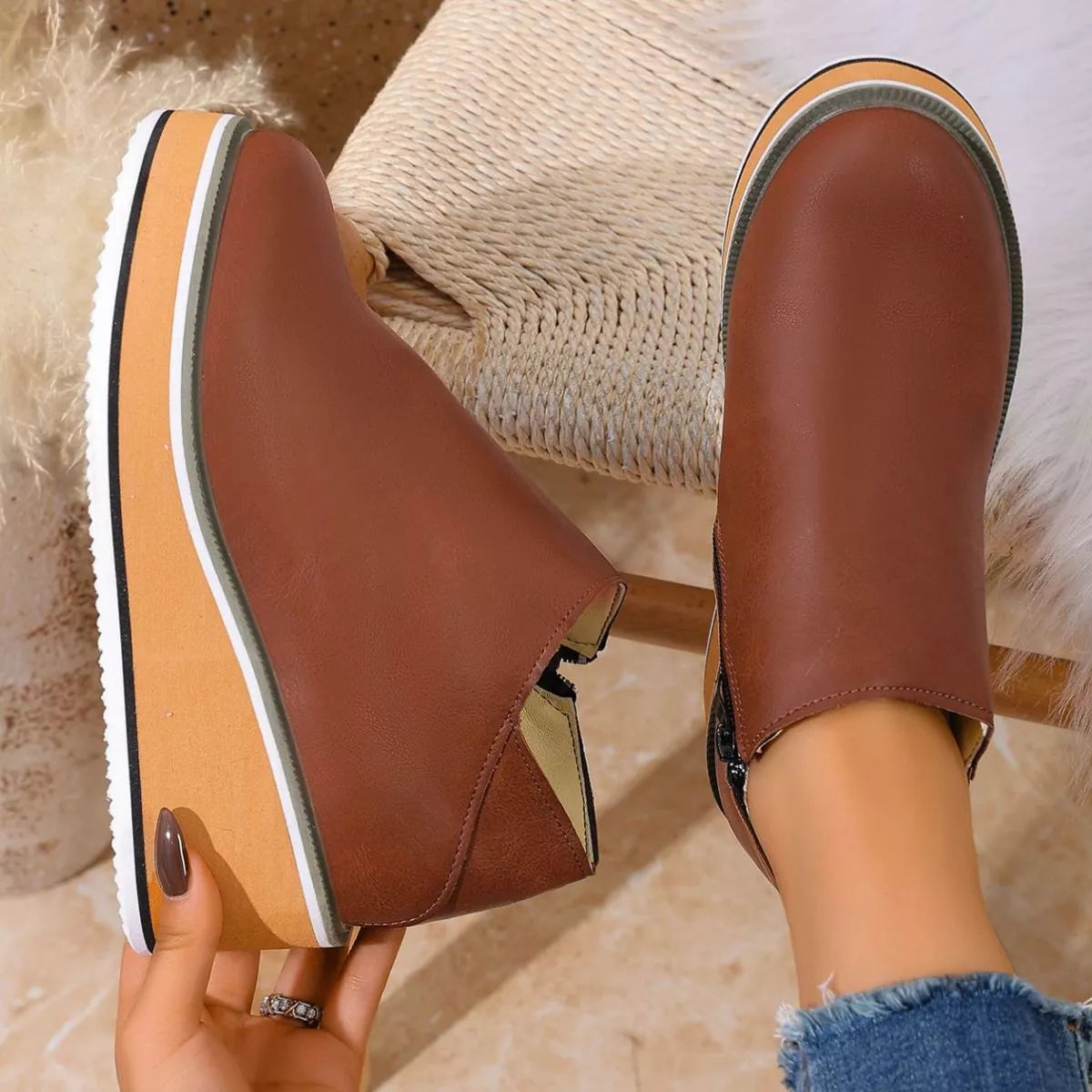 Women's round toe wedge ankle boots by Trendsi featuring stylish leather upper and chunky heel for versatile wear.
