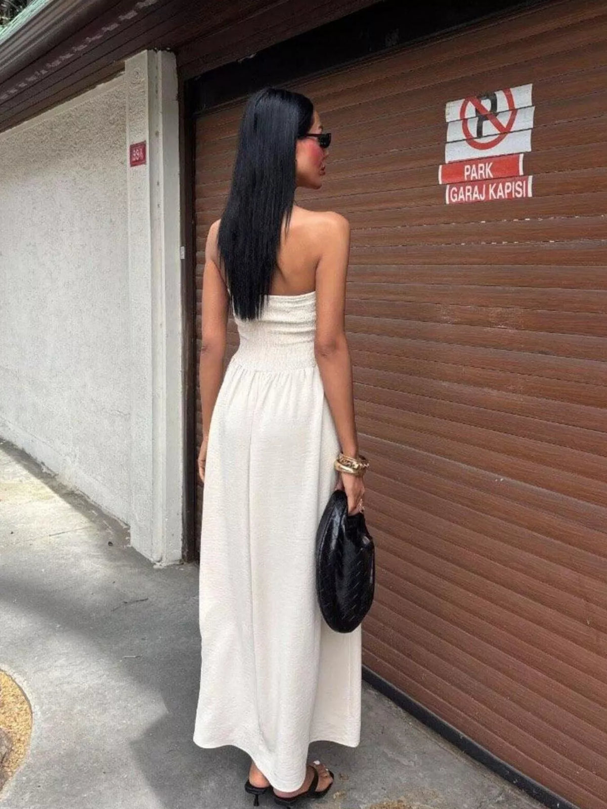 Strapless smocked maxi dress by Plush Fashion Hub featuring a flowing silhouette and stylish design, perfect for summer wear.