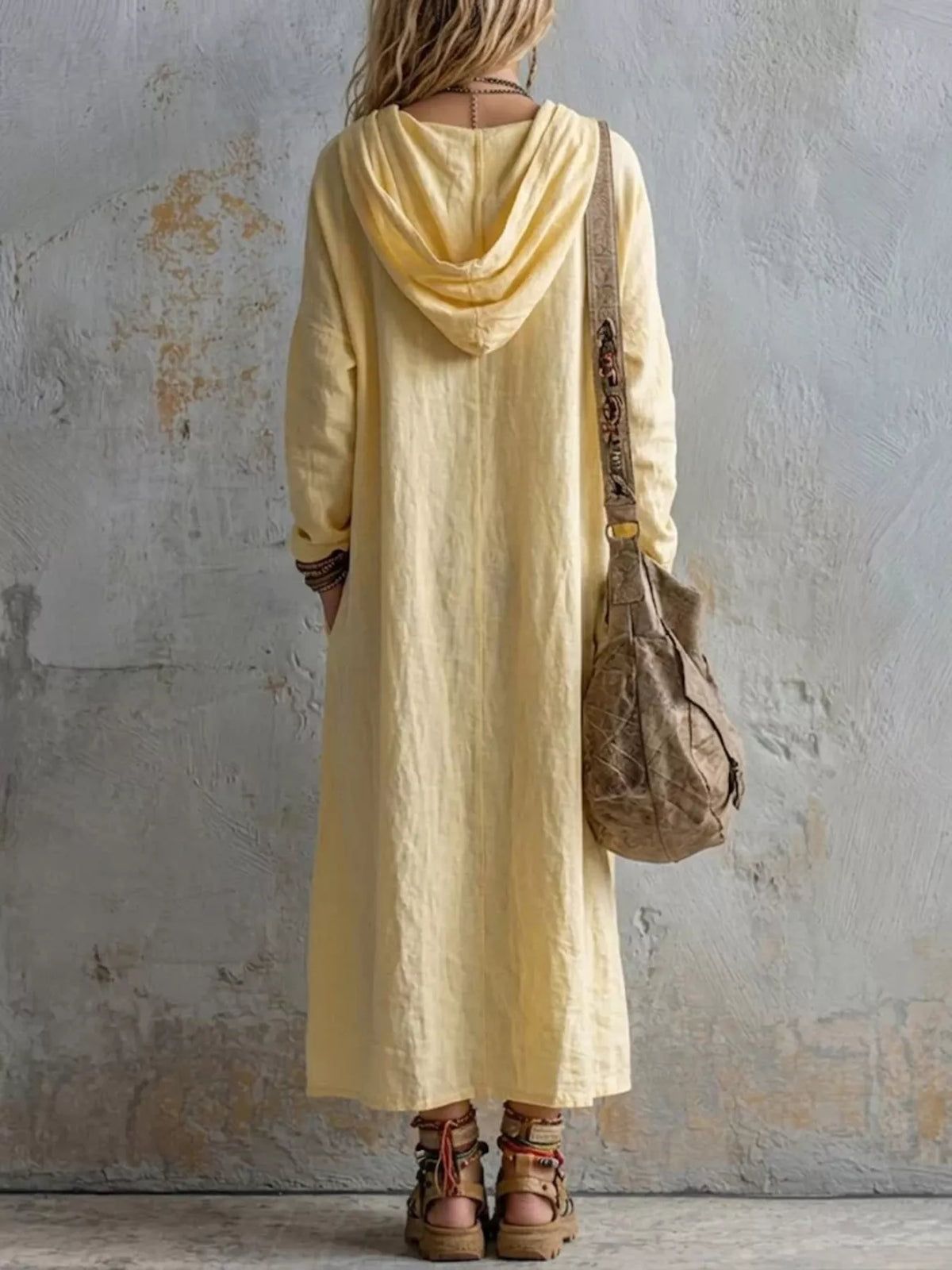 Women’s long sleeve hooded midi dress with pockets by Trendsi, featuring a comfortable fit and stylish design.