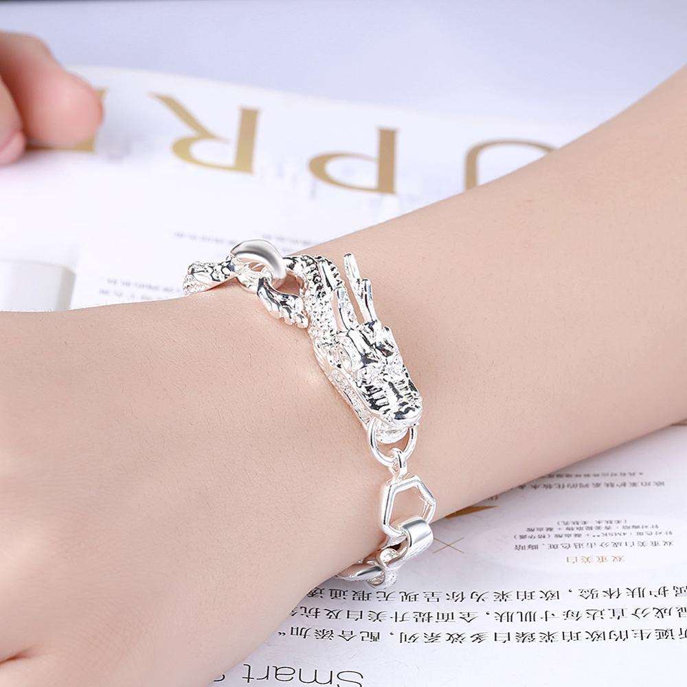 Unisex white dragon braceletExperience the powerful energy and elegance of our Unisex White Dragon Bracelet. Crafted from environmentally-friendly copper and electroplated with 925 silver, the BraceletPlush Fashions ShopPlush Fashion Shop