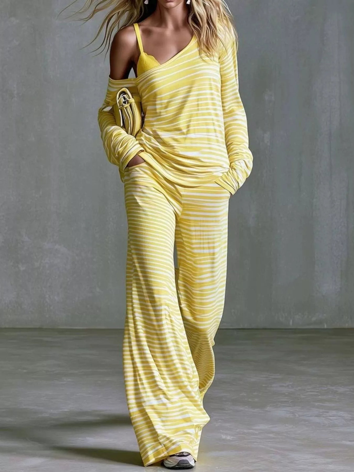 Women’s striped boat neck top and pants set by Trendsi, featuring a stylish, coordinated casual outfit with a boat neckline.