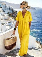 V-neck short-sleeve high waist maxi dress by FitiqueFit, featuring a flowy resort style design in lightweight fabric.