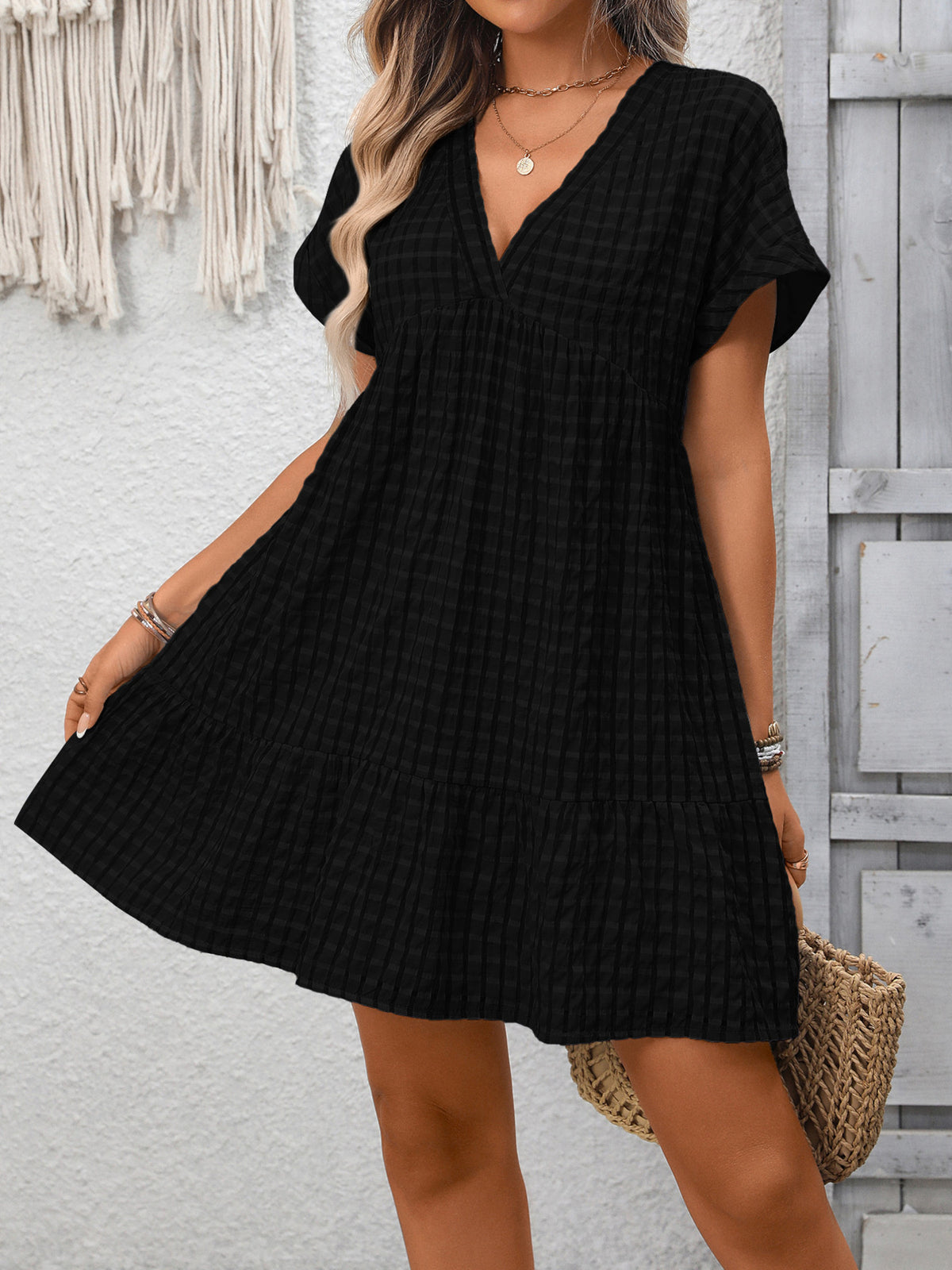 Plush Fashion Hub chic plaid V-neck mini dress with ruffle hem, perfect for casual or dressy occasions.