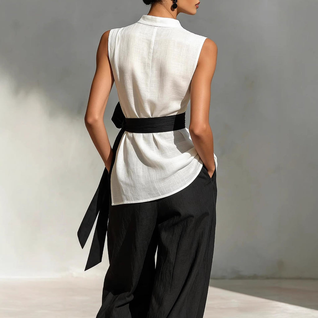 White women's lace-up sleeveless top and wide-leg pants two-piece set by FitiqueFit, casualwear, shown on model.