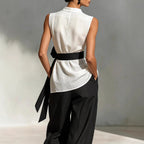 White women's lace-up sleeveless top and wide-leg pants two-piece set by FitiqueFit, casualwear, shown on model.