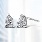 14K white gold pear-shaped lab-grown diamond stud earrings with F-G color, VS2-SI1 clarity, showcasing elegant sparkle.