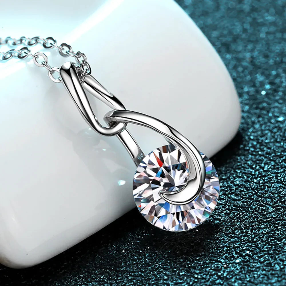 Sterling silver moissanite necklace with 2-carat gemstone, featuring a sleek, elegant design showcasing the sparkling stone.