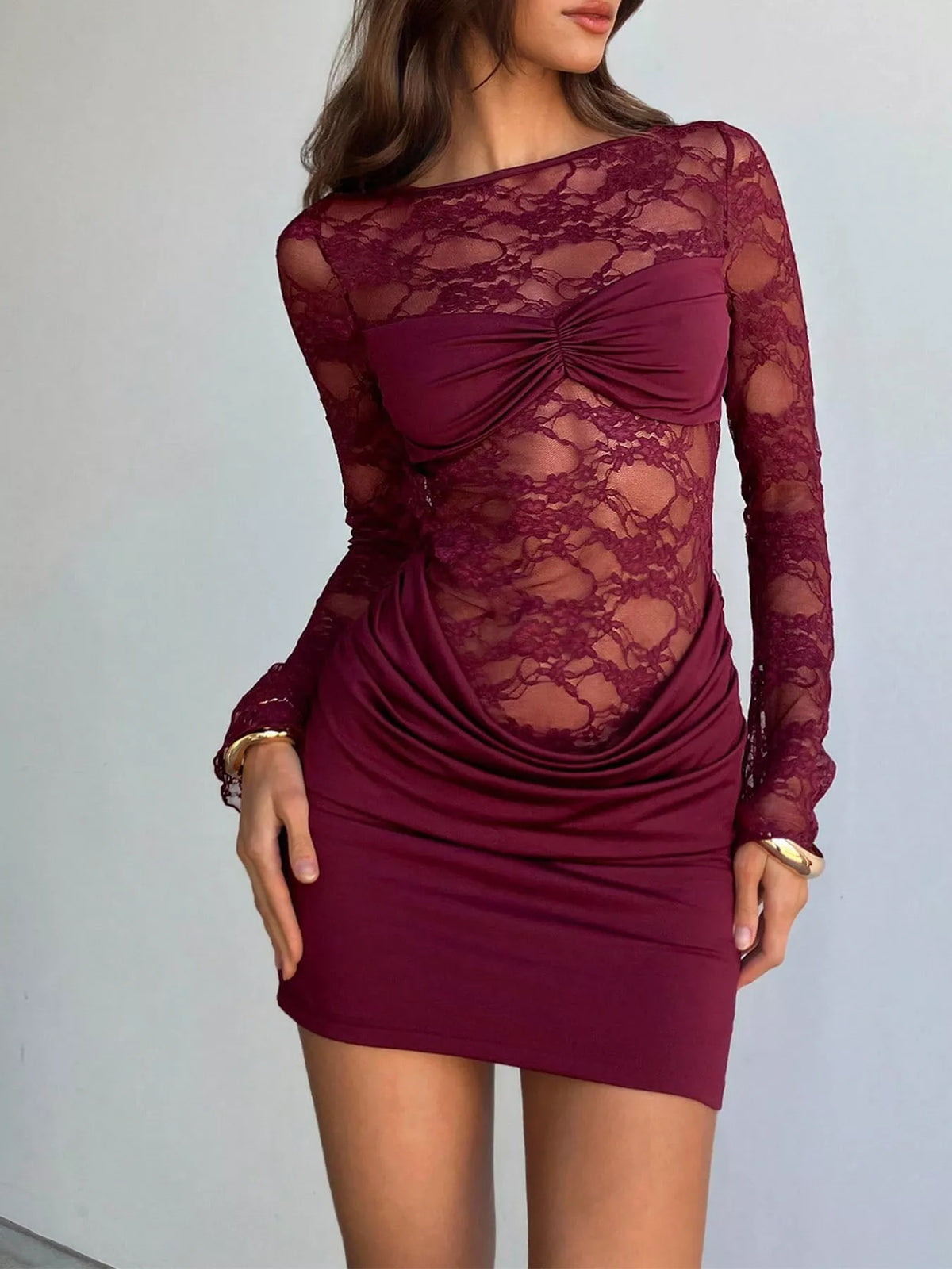 Lace sheer cutout back long sleeve ruched dress by Plush Fashion Hub, featuring fitted silhouette and elegant design.