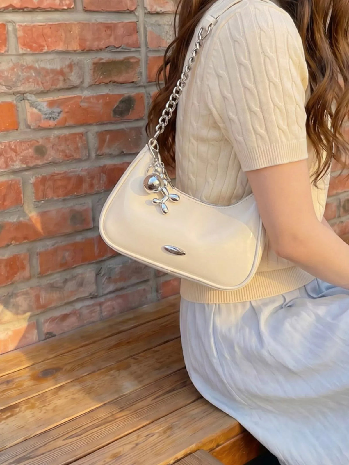Trendsi PU leather shoulder handbag with adjustable strap and spacious interior, stylish for everyday use.