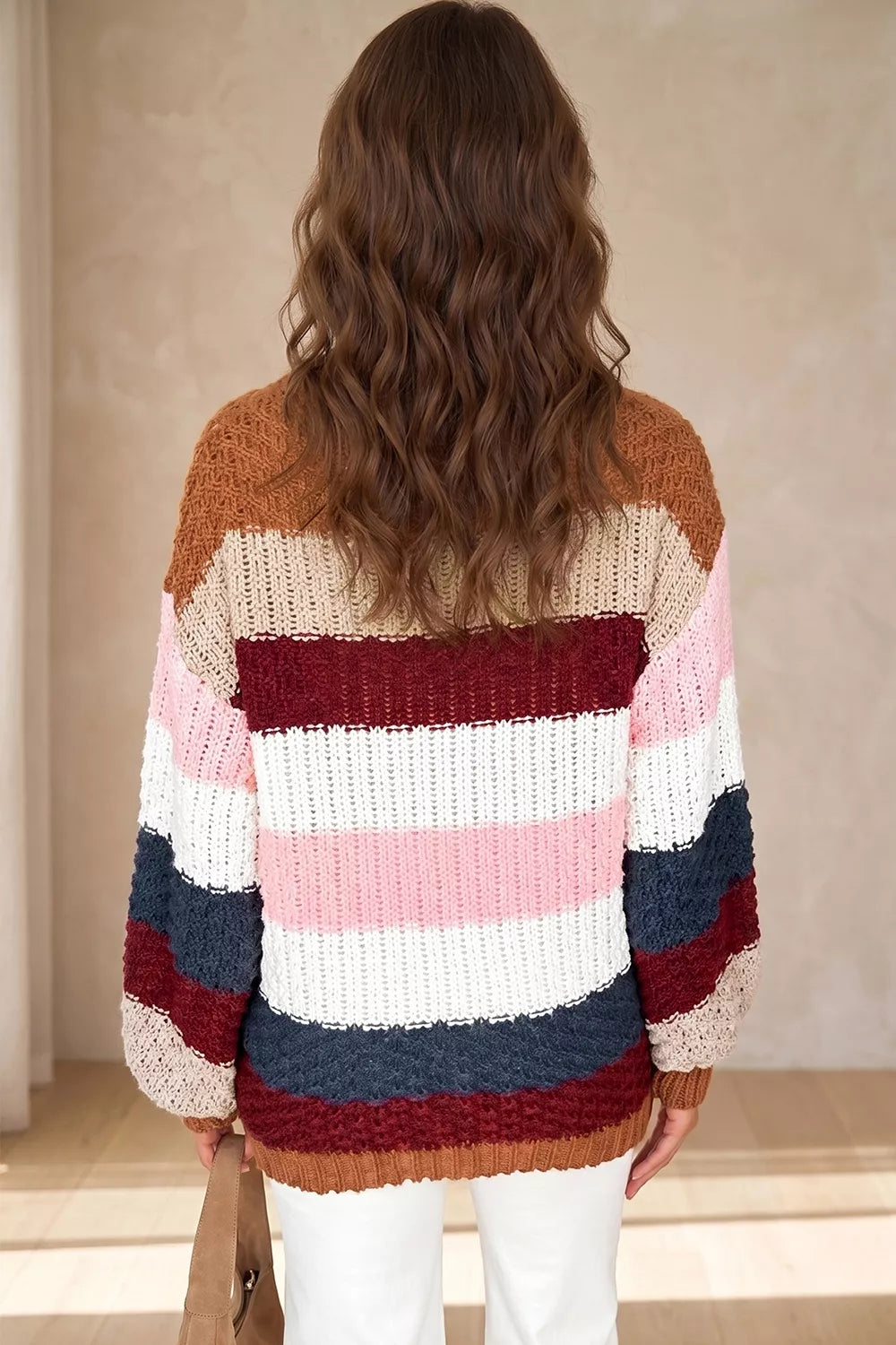 Striped knit sweater with dropped shoulders and round neck by Trendsi, featuring a casual, cozy design in soft fabric.