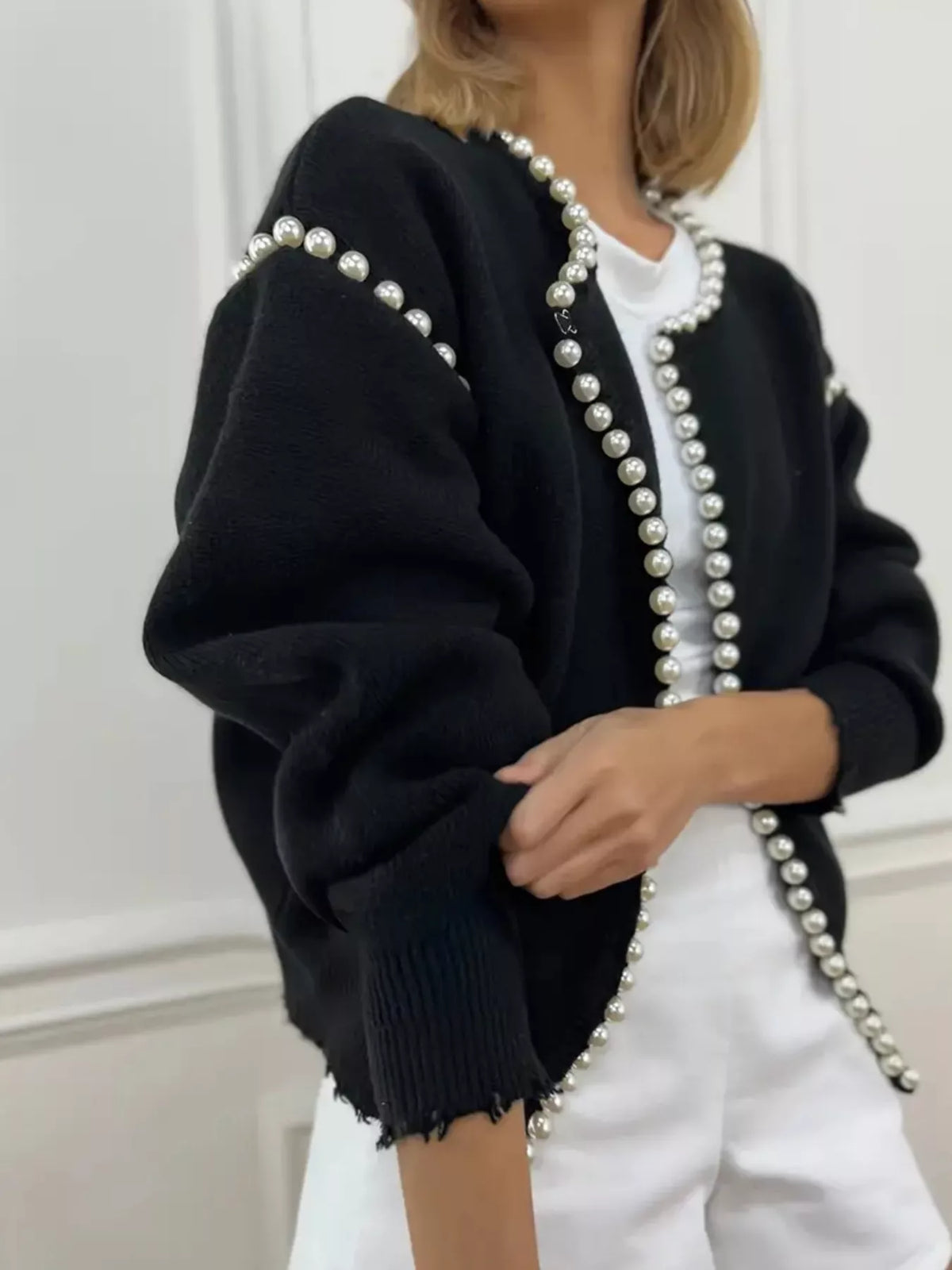 Pearl-trimmed open front women's cardigan by Trendsi, featuring a soft knit fabric and stylish pearl accents.