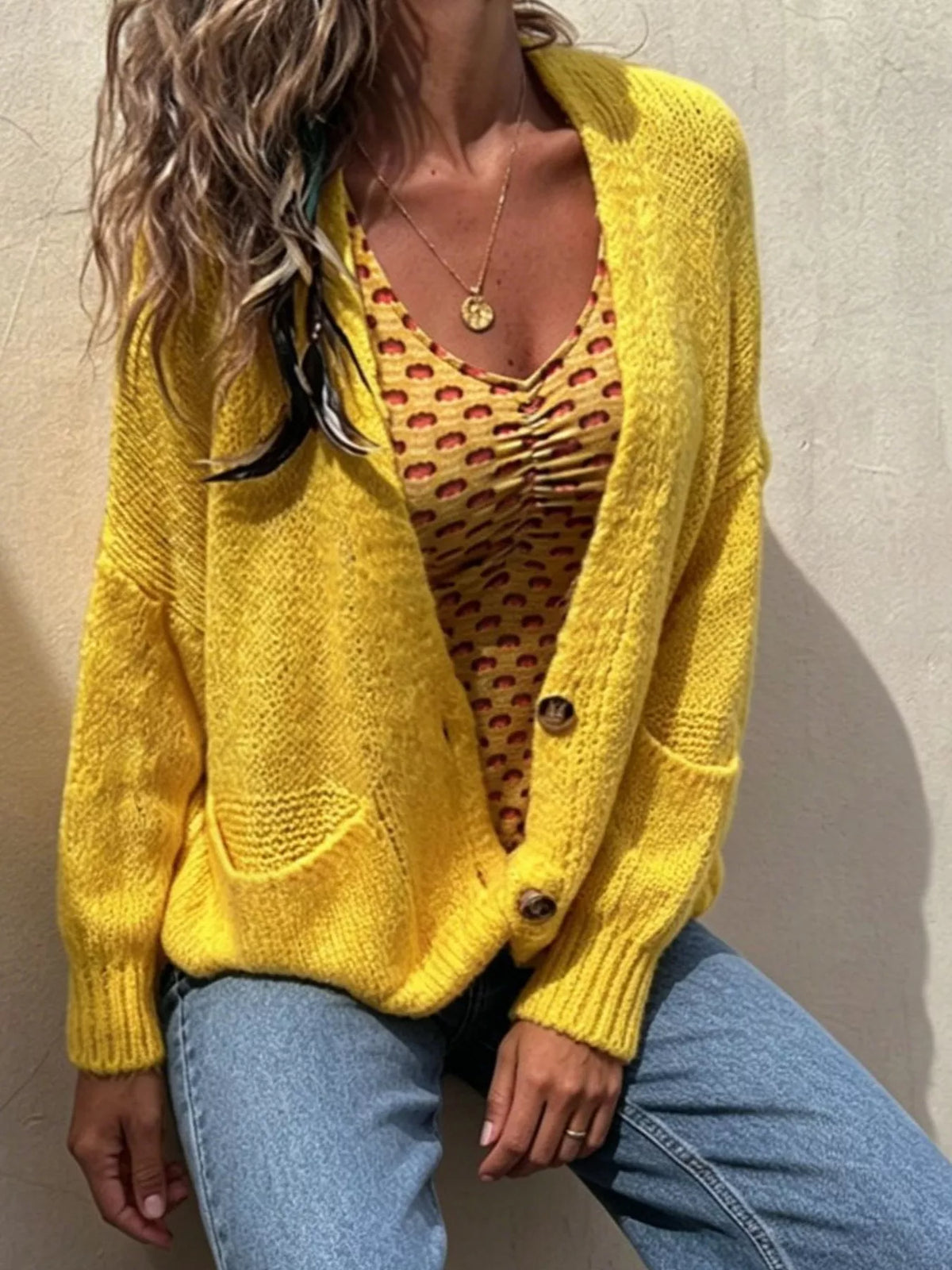 Plus size chunky knit button-up cardigan by Trendsi, showing a cozy, oversized knit sweater with large buttons on a model.