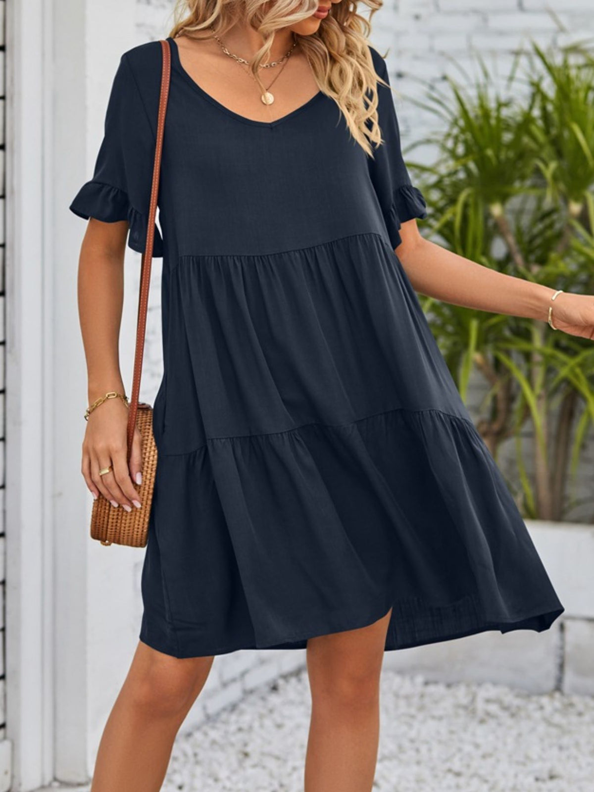 Lightweight rayon ruffled sleeve tiered mini dress with pockets by Plush Fashion Hub, showcasing a stylish, flowy design.