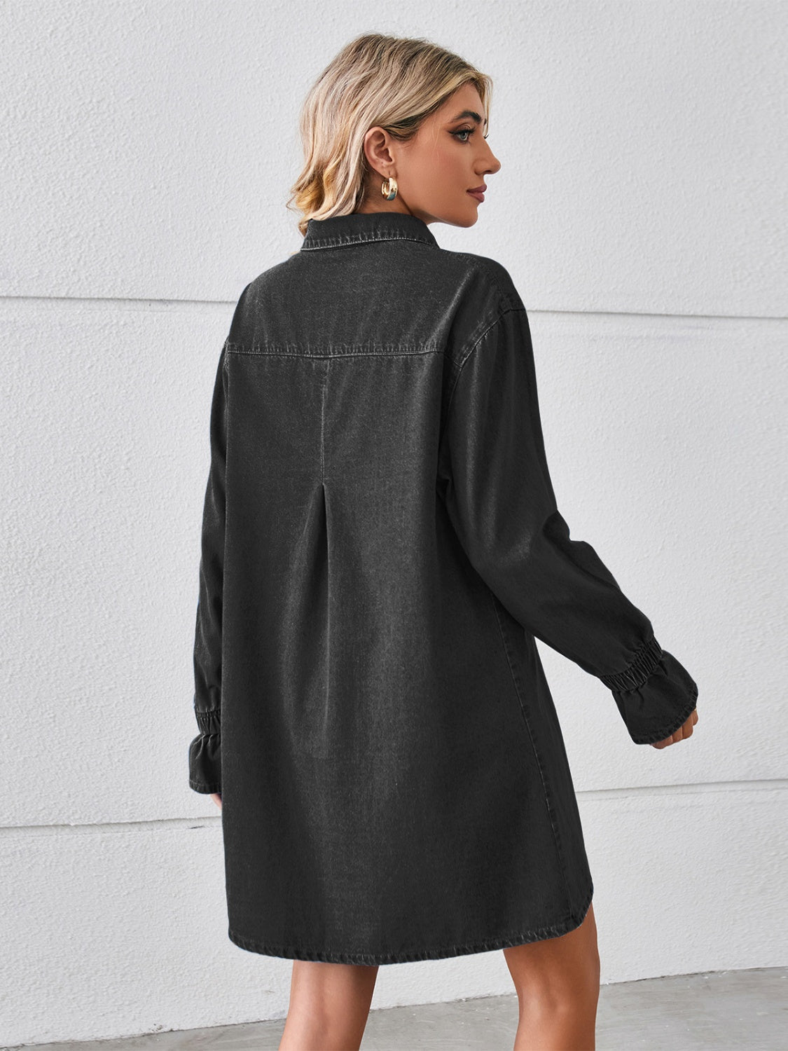 Plush Fashion Hub pocketed dropped shoulder mini denim dress displayed on a mannequin, showcasing casual style and relaxed fit.